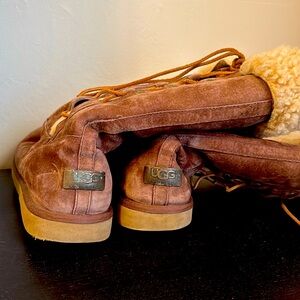 Uggs slip on able to tighten on side nice warm inside and on the top nice fur